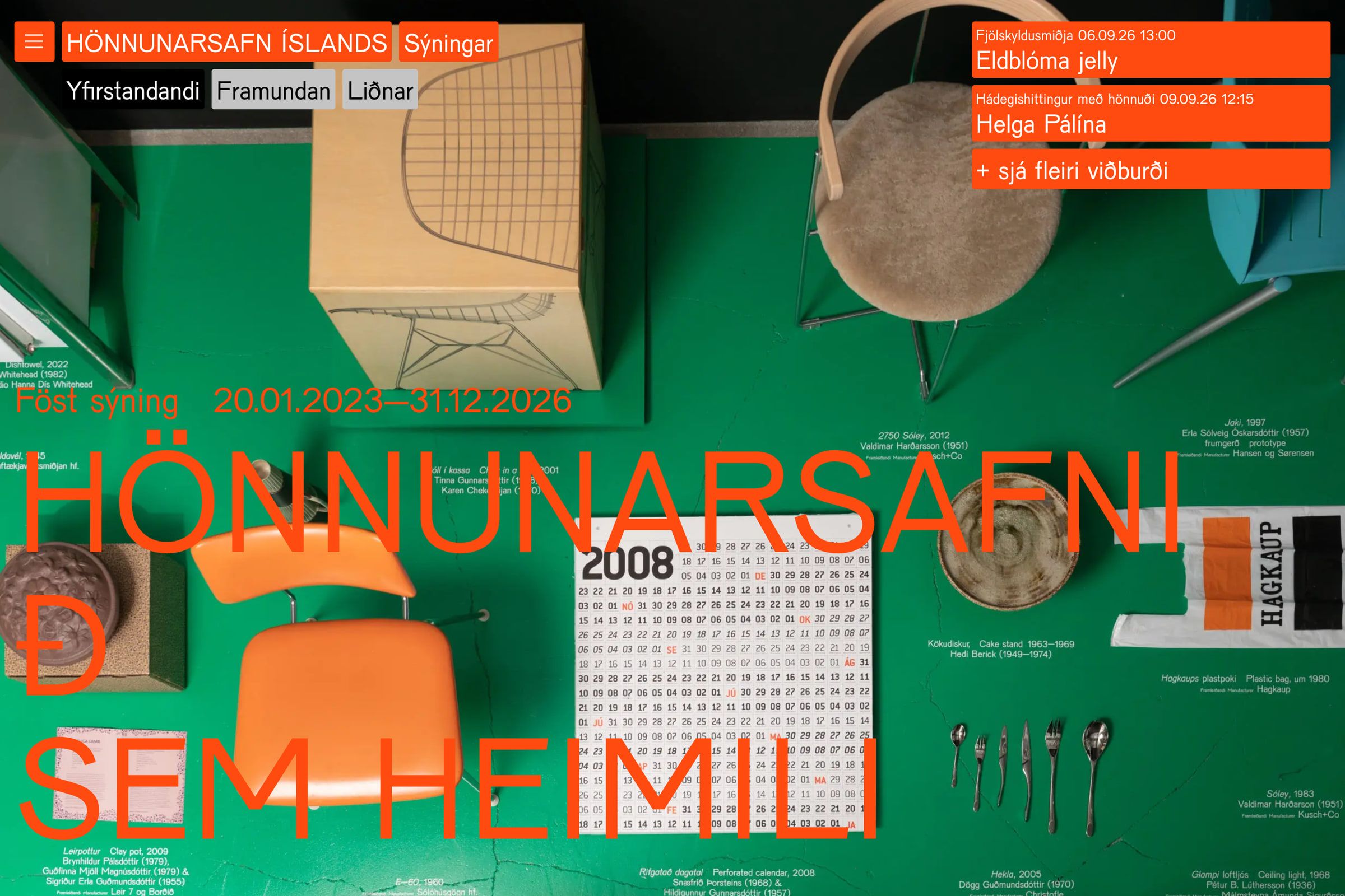 An exhibition page's hero photograph in its original colours: a green floor with chairs, a wall calendar and household objects laid out, the exhibition title over it.
