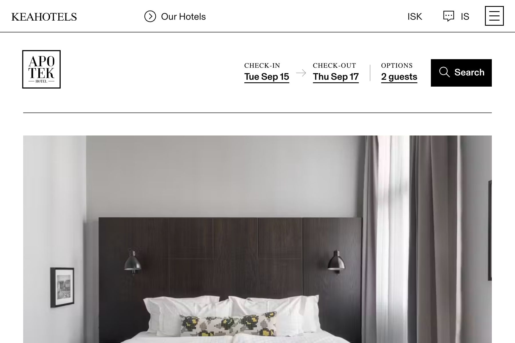 The booking flow on a narrow screen: the compact header with a menu button, the hotel's logo, the booking bar with dates and guests on one line, and the top of a photograph of the first room.